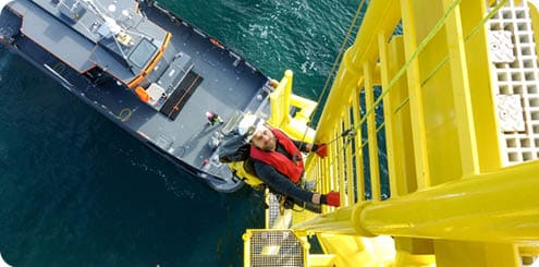 Wind-turbine, offshore, worker, climbing, high up, boat, sea