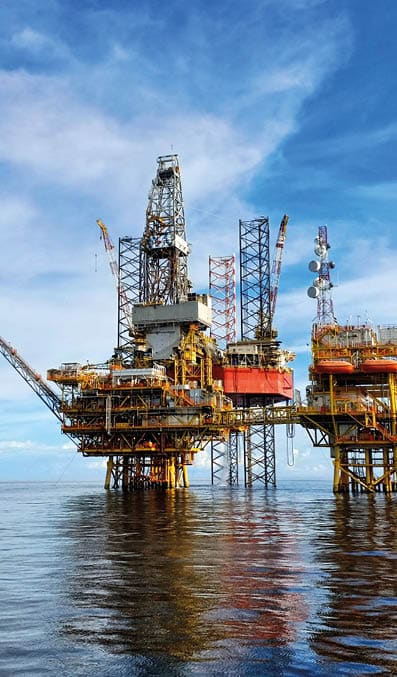 Offshore oil platform for production of oil and gas  Jack up rig to drill new well in sarawak sea during clear sunny day 