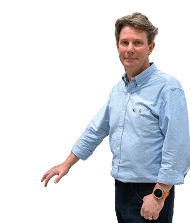 A man wearing a blue shirt and black pants. Description generated by AI
