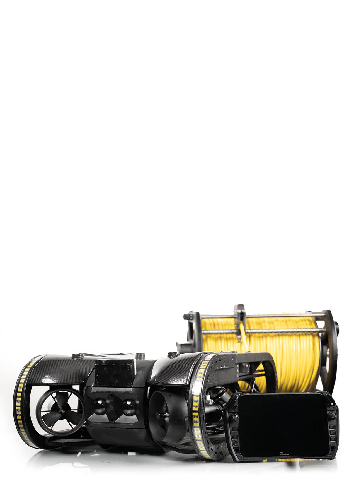 Two black and yellow hoses are laying on the ground. Description generated by AI