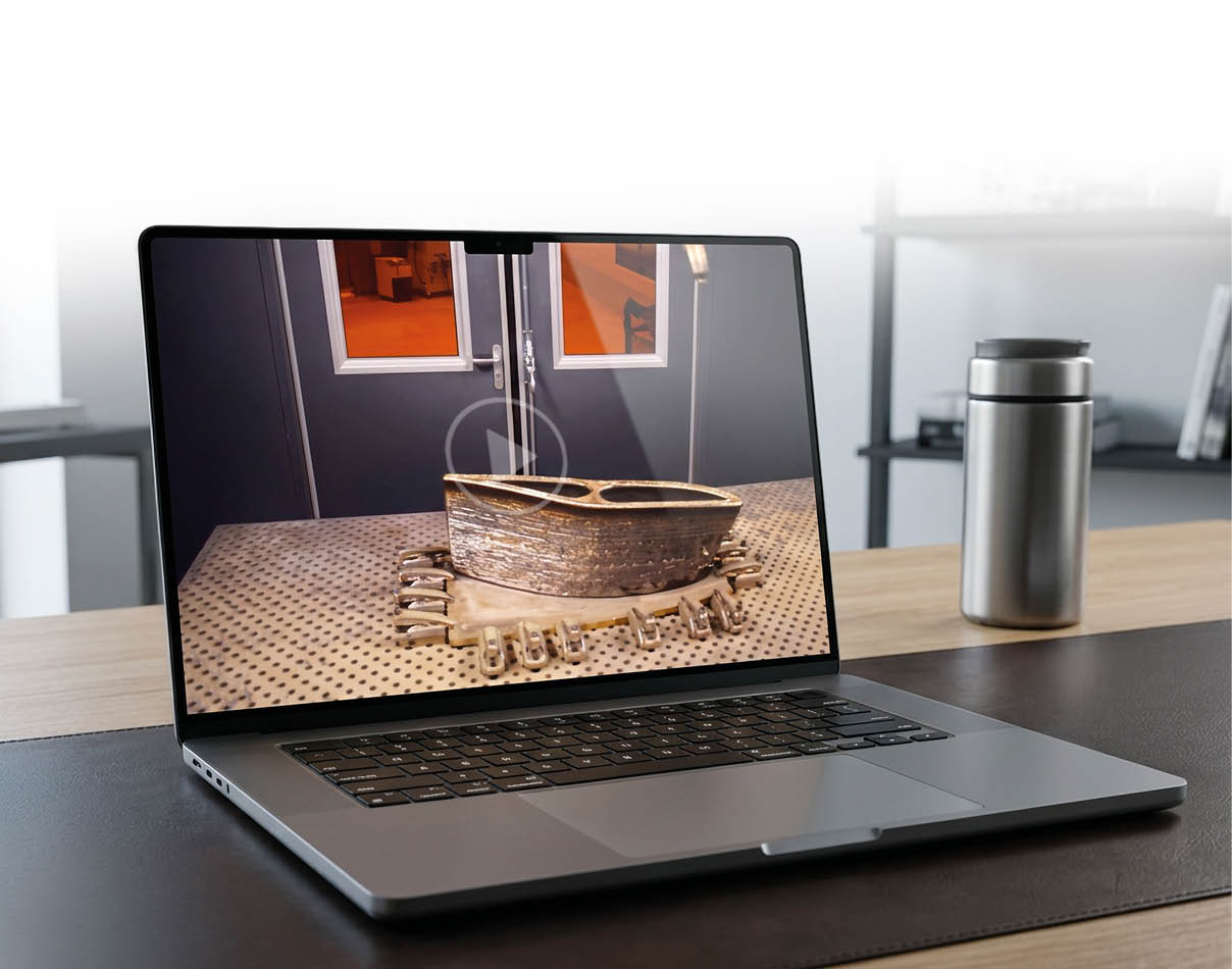 A laptop computer with a picture of a metal object on the screen. Description generated by AI