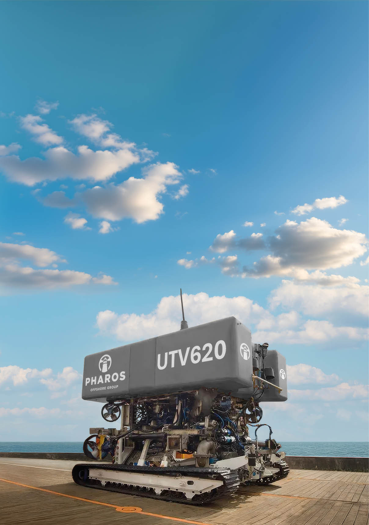 A large blue and white boat with the word Pharos on it. Description generated by AI