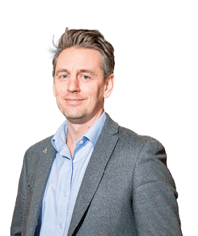 A man wearing a gray suit and blue shirt. Description generated by AI