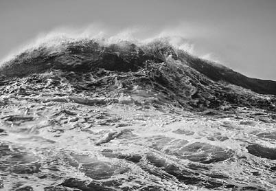 A large wave in the ocean. Description generated by AI