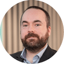 A man wearing a suit and tie. Description generated by AI
