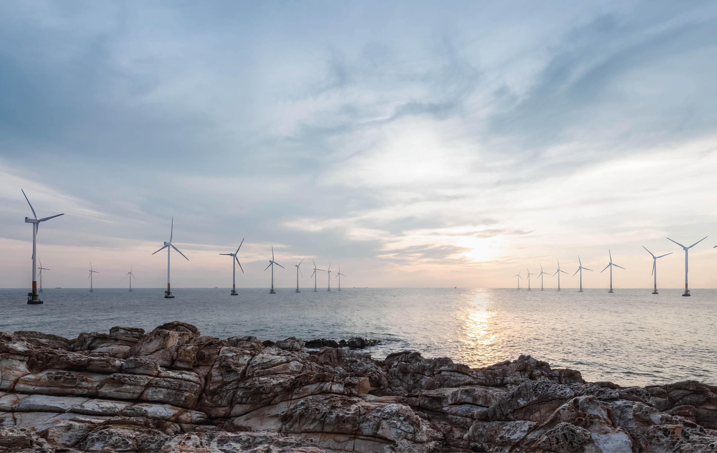 offshore wind farm in sunrise, renewable energy